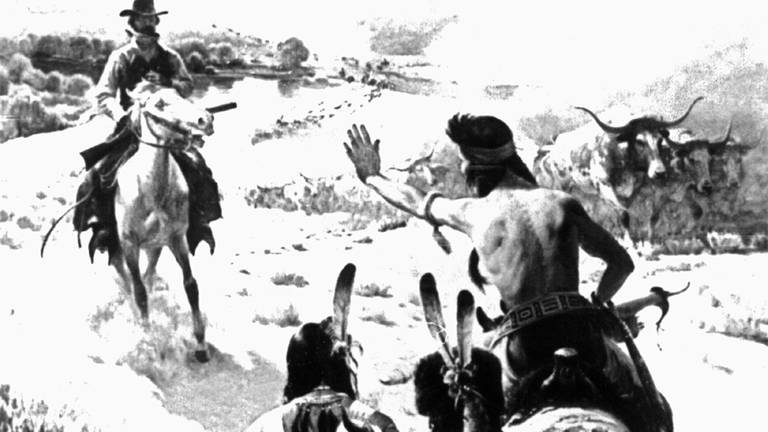 Das Gemälde zeigt, wie "Indianer" und ein weißer Siedler in der Prärie aufeinandertreffen.